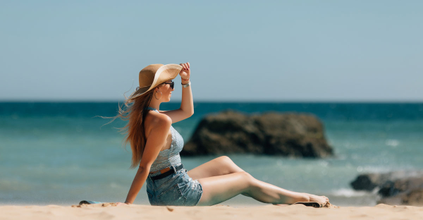 young-woman-sitting-sea-beach-1
